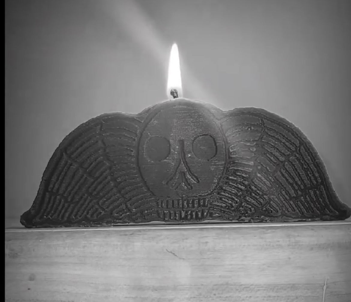 Death head winged skull candle